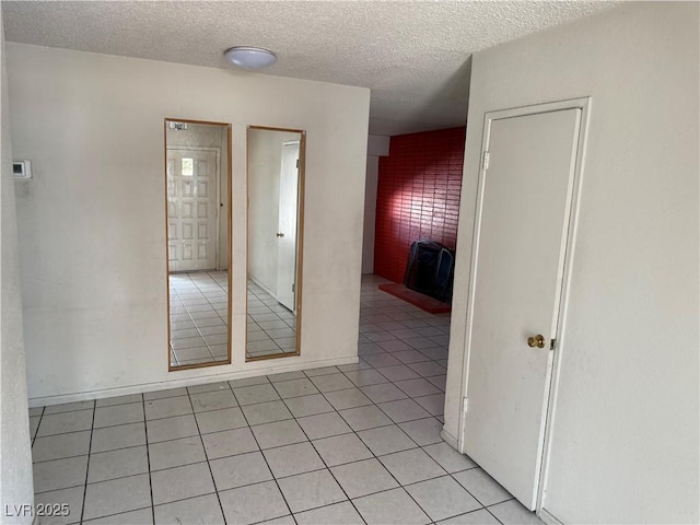 1674 Seneca Ln, Las Vegas, NV 89169 - unfurnished room with light tile patterned floors and a textured ceiling