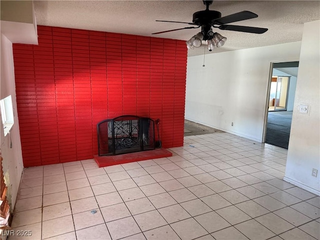 1674 Seneca Ln, Las Vegas, NV 89169 - unfurnished living room featuring a textured ceiling, ceiling fan, light tile patterned floors, and a brick fireplace