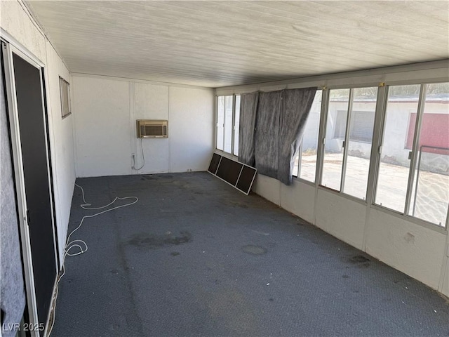 1674 Seneca Ln, Las Vegas, NV 89169 - unfurnished sunroom featuring healthy amount of natural light and a wall mounted air conditioner