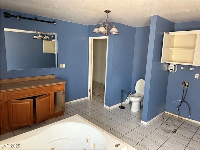 1674 Seneca Ln, Las Vegas, NV 89169 - bathroom with a chandelier, a jetted tub, toilet, baseboards, and a textured ceiling