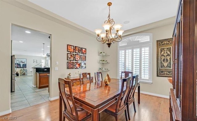 10001 Blairwood Ct, Las Vegas, NV 89178 - dining room featuring light wood finished floors, a chandelier, recessed lighting, and baseboards