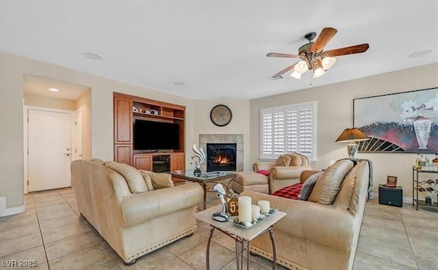 10001 Blairwood Ct, Las Vegas, NV 89178 - living area featuring a ceiling fan, a fireplace, baseboards, and light tile patterned floors