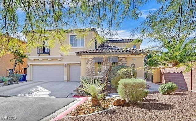 10001 Blairwood Ct, Las Vegas, NV 89178 - mediterranean / spanish house featuring a garage, stucco siding, concrete driveway, stone siding, and a tile roof