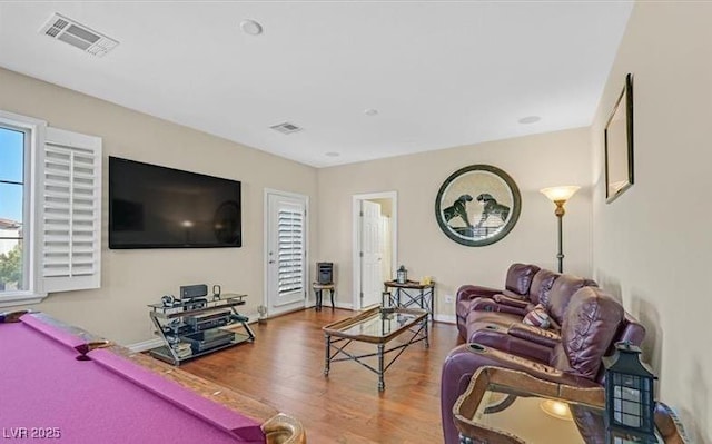 10001 Blairwood Ct, Las Vegas, NV 89178 - living room with billiards table, wood finished floors, and baseboards