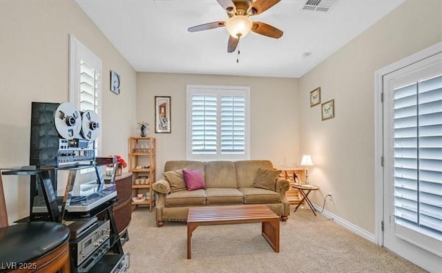 10001 Blairwood Ct, Las Vegas, NV 89178 - living area featuring plenty of natural light, ceiling fan, and light carpet