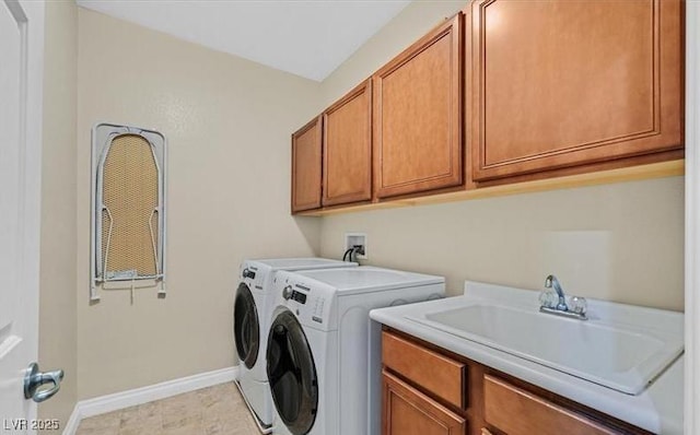 10001 Blairwood Ct, Las Vegas, NV 89178 - laundry room featuring washing machine and clothes dryer, cabinet space, and baseboards