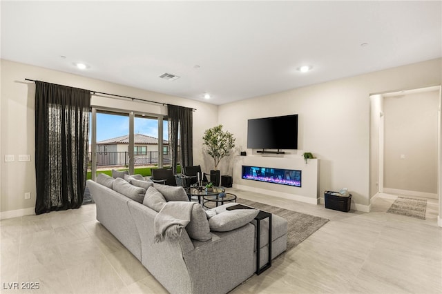 230 Cactus Sunrise St, Las Vegas, NV 89138 - living room with a glass covered fireplace, baseboards, and recessed lighting