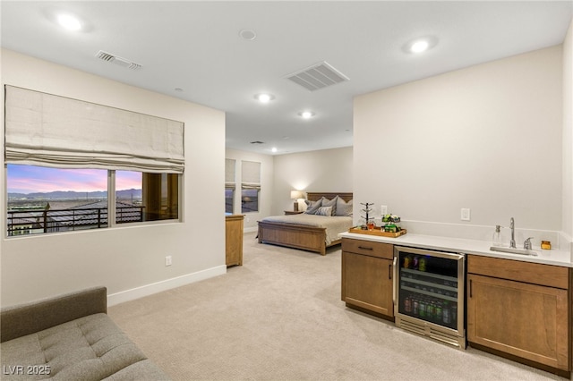 230 Cactus Sunrise St, Las Vegas, NV 89138 - indoor wet bar with wine cooler, light carpet, baseboards, and recessed lighting