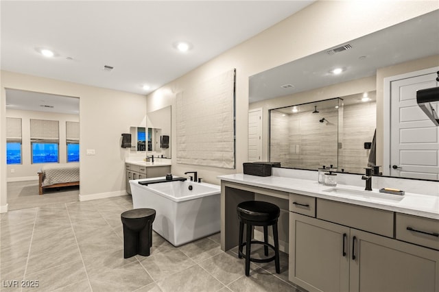 230 Cactus Sunrise St, Las Vegas, NV 89138 - full bathroom with a shower stall, two vanities, a freestanding tub, tile patterned flooring, and recessed lighting