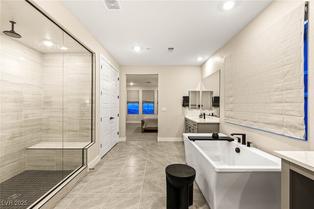 230 Cactus Sunrise St, Las Vegas, NV 89138 - full bathroom with a shower stall, vanity, a freestanding tub, tile patterned flooring, and recessed lighting