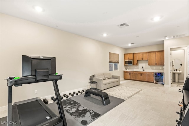 230 Cactus Sunrise St, Las Vegas, NV 89138 - exercise area with wine cooler, a sink, baseboards, and recessed lighting