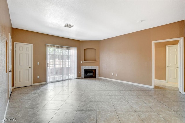 4730 E Craig Rd Unit 1005, Las Vegas, NV 89115 - unfurnished living room with a fireplace and light tile patterned floors