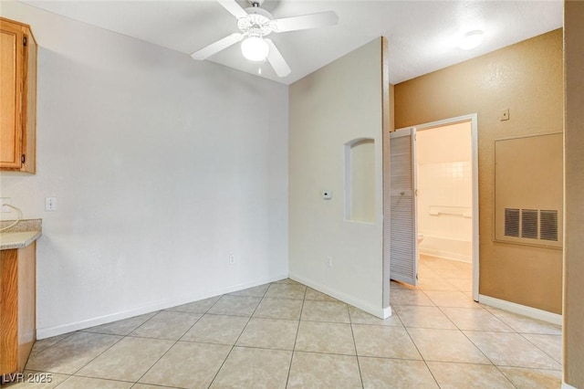 4730 E Craig Rd Unit 1005, Las Vegas, NV 89115 - unfurnished dining area with light tile patterned floors and a ceiling fan
