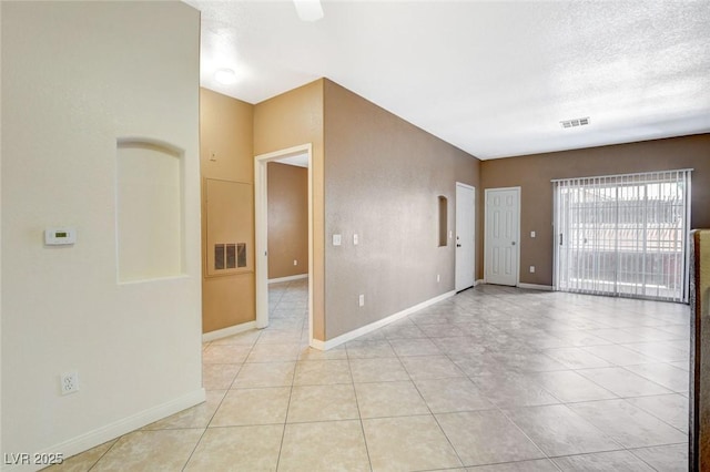4730 E Craig Rd Unit 1005, Las Vegas, NV 89115 - empty room featuring light tile patterned floors and a textured ceiling