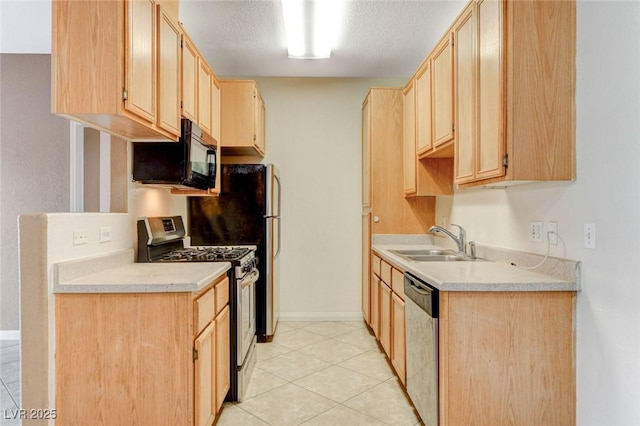4730 E Craig Rd Unit 1005, Las Vegas, NV 89115 - kitchen featuring appliances with stainless steel finishes, light brown cabinets, light countertops, a textured ceiling, and light tile patterned flooring