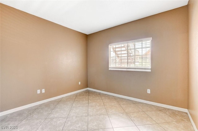 4730 E Craig Rd Unit 1005, Las Vegas, NV 89115 - unfurnished room with baseboards and light tile patterned floors
