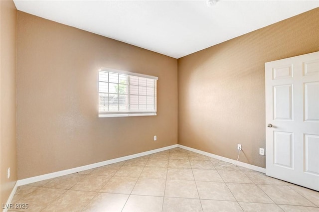 4730 E Craig Rd Unit 1005, Las Vegas, NV 89115 - empty room with baseboards and light tile patterned flooring