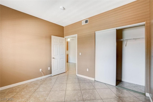 4730 E Craig Rd Unit 1005, Las Vegas, NV 89115 - unfurnished bedroom with a closet and light tile patterned floors