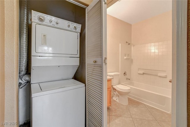 4730 E Craig Rd Unit 1005, Las Vegas, NV 89115 - washroom featuring stacked washer / dryer and light tile patterned floors