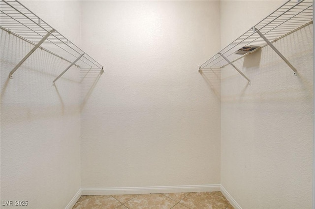 4730 E Craig Rd Unit 1005, Las Vegas, NV 89115 - walk in closet featuring light tile patterned floors