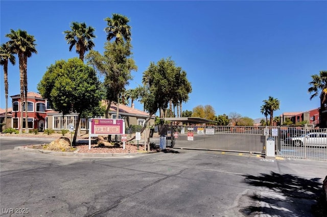 4730 E Craig Rd Unit 1005, Las Vegas, NV 89115 - view of asphalt street featuring a gate, a gated entry, and curbs