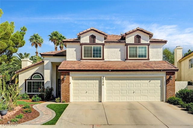 2036 Deer Springs Dr, Henderson, NV 89074 - traditional-style house with a garage, driveway, brick siding, and a tiled roof