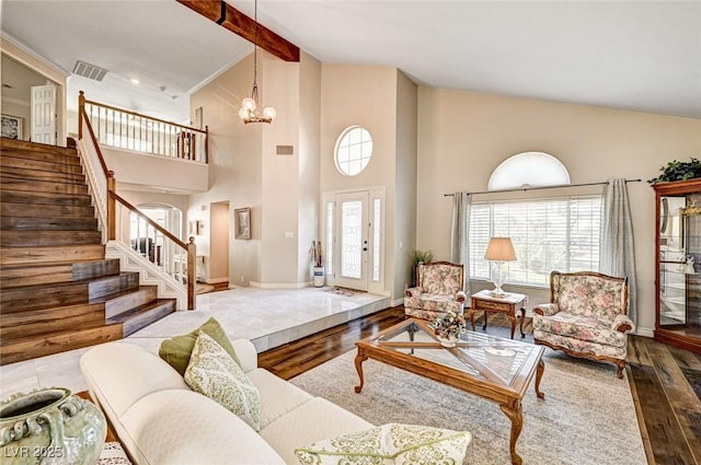 2036 Deer Springs Dr, Henderson, NV 89074 - living room featuring wood finished floors, stairs, high vaulted ceiling, a chandelier, and baseboards