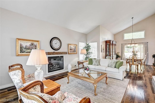 2036 Deer Springs Dr, Henderson, NV 89074 - living room with plenty of natural light, high vaulted ceiling, dark wood-style flooring, and baseboards