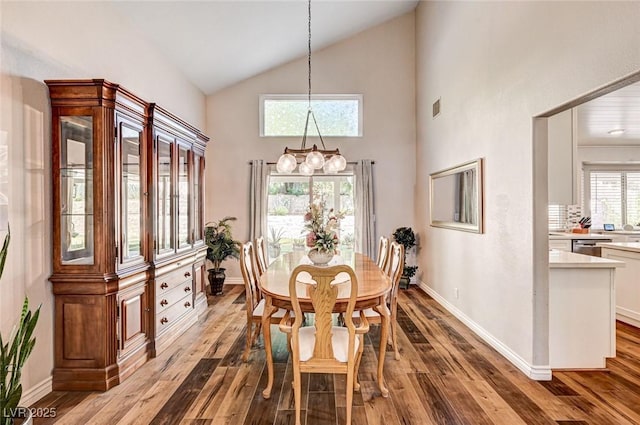 2036 Deer Springs Dr, Henderson, NV 89074 - dining space featuring hardwood / wood-style floors, high vaulted ceiling, and baseboards
