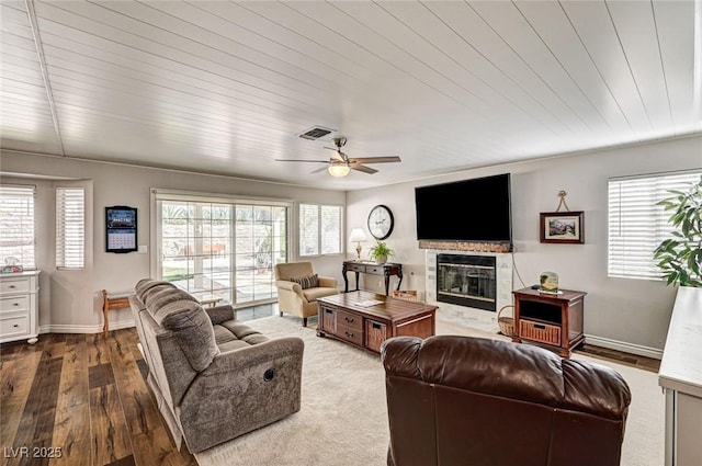 2036 Deer Springs Dr, Henderson, NV 89074 - living room with a fireplace, healthy amount of natural light, dark wood finished floors, and a ceiling fan