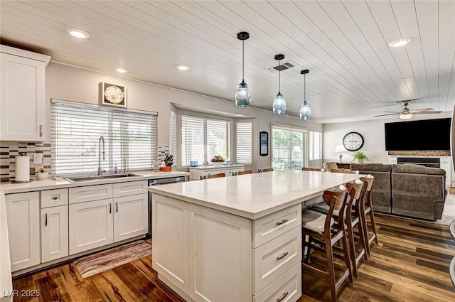 2036 Deer Springs Dr, Henderson, NV 89074 - kitchen featuring a sink, wooden ceiling, dark wood finished floors, light countertops, and recessed lighting