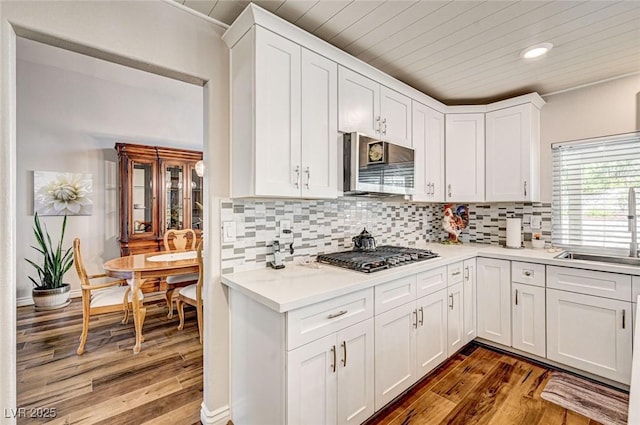 2036 Deer Springs Dr, Henderson, NV 89074 - kitchen featuring appliances with stainless steel finishes, a sink, dark wood-style floors, light countertops, and wooden ceiling