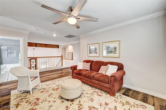 2036 Deer Springs Dr, Henderson, NV 89074 - living room with arched walkways, ceiling fan, wood finished floors, crown molding, and baseboards