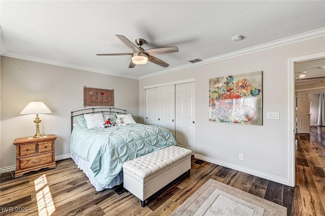 2036 Deer Springs Dr, Henderson, NV 89074 - bedroom with crown molding, baseboards, a closet, wood finished floors, and a ceiling fan