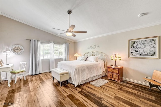 2036 Deer Springs Dr, Henderson, NV 89074 - bedroom with wood finished floors, crown molding, lofted ceiling, ceiling fan, and baseboards