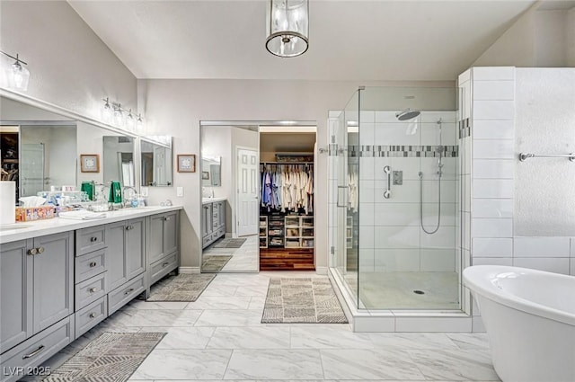 2036 Deer Springs Dr, Henderson, NV 89074 - bathroom with a stall shower, double vanity, marble look tile flooring, a freestanding bath, and a spacious closet
