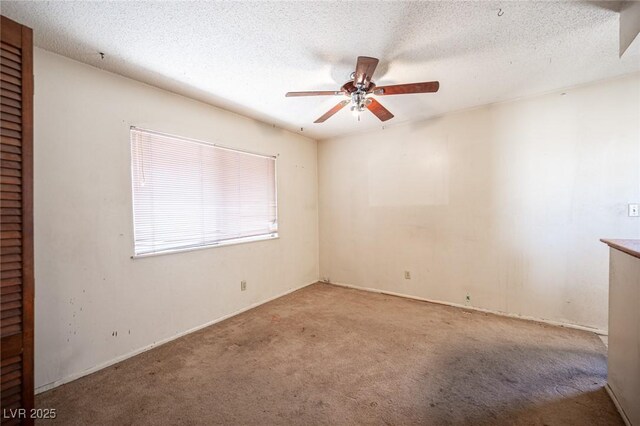 4516 E Flamingo Rd, Las Vegas, NV 89121 - spare room featuring ceiling fan, carpet flooring, and a textured ceiling