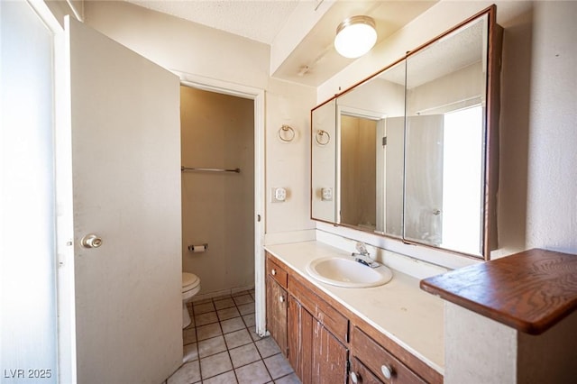 4516 E Flamingo Rd, Las Vegas, NV 89121 - bathroom with vanity, toilet, and tile patterned flooring