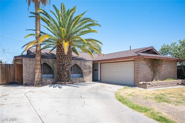 4516 E Flamingo Rd, Las Vegas, NV 89121 - single story home featuring an attached garage, driveway, and brick siding