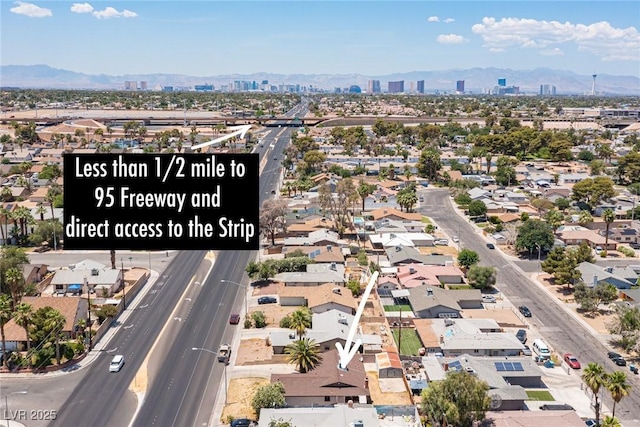 4516 E Flamingo Rd, Las Vegas, NV 89121 - view of property location featuring a mountain backdrop, nearby urban area, and a main thoroughfare