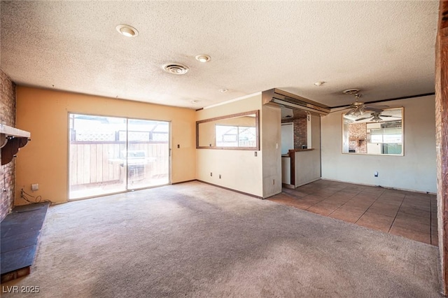 4516 E Flamingo Rd, Las Vegas, NV 89121 - unfurnished living room with a textured ceiling, carpet, a ceiling fan, and tile patterned floors