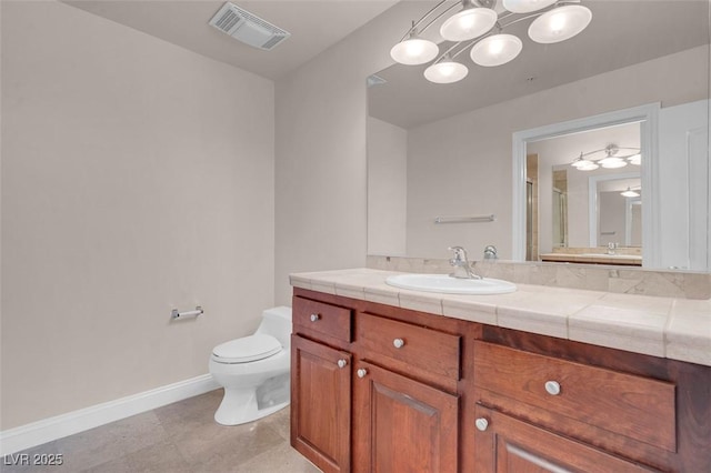 87 E Agate Ave Unit 403, Las Vegas, NV 89123 - full bathroom featuring baseboards, toilet, vanity, an enclosed shower, and tile patterned floors