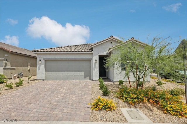 3024 River Brook Ct, Las Vegas, NV 89139 - view of front facade with a garage, stucco siding, a tile roof, and decorative driveway