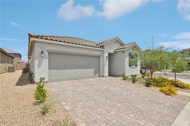 3024 River Brook Ct, Las Vegas, NV 89139 - mediterranean / spanish-style home featuring stucco siding, central air condition unit, an attached garage, and decorative driveway