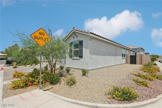 3024 River Brook Ct, Las Vegas, NV 89139 - view of property exterior featuring stucco siding and a tiled roof