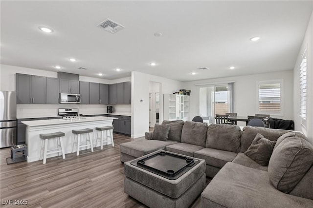 3024 River Brook Ct, Las Vegas, NV 89139 - living area featuring wood finished floors and recessed lighting