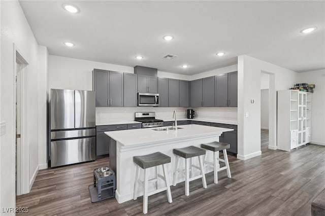 3024 River Brook Ct, Las Vegas, NV 89139 - kitchen featuring appliances with stainless steel finishes, a sink, gray cabinetry, and recessed lighting
