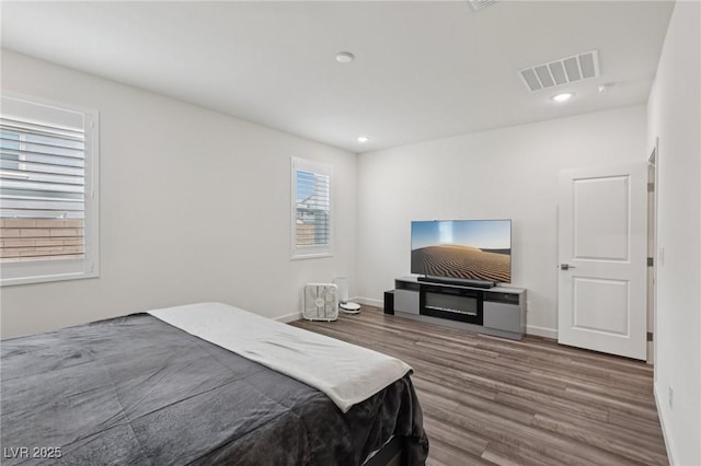 3024 River Brook Ct, Las Vegas, NV 89139 - bedroom with wood finished floors, baseboards, and recessed lighting