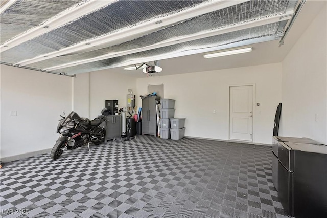 3024 River Brook Ct, Las Vegas, NV 89139 - garage featuring a garage door opener and baseboards