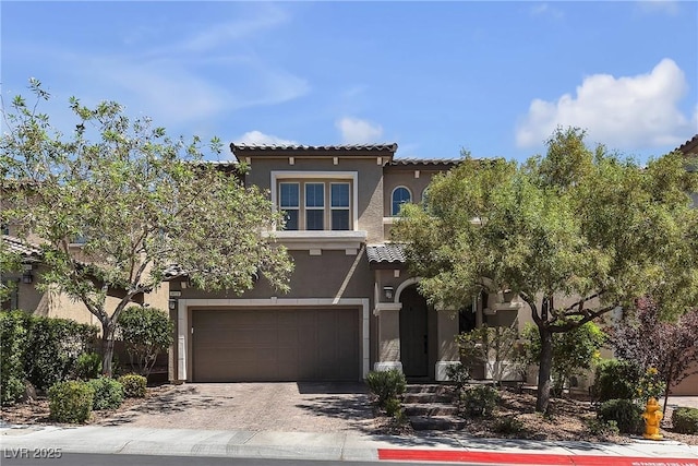 9950 Coyote Echo Ct, Las Vegas, NV 89166 - mediterranean / spanish home with stucco siding, a tile roof, driveway, and a garage